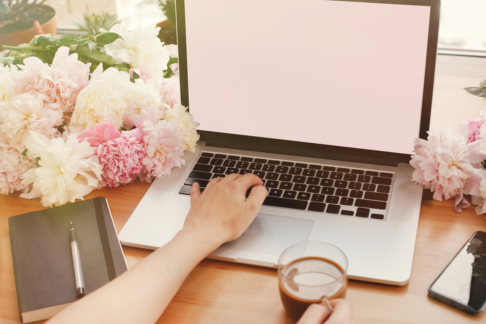 Girl Hands on Stylish Laptop with Empty Screen and Coffee, Phone